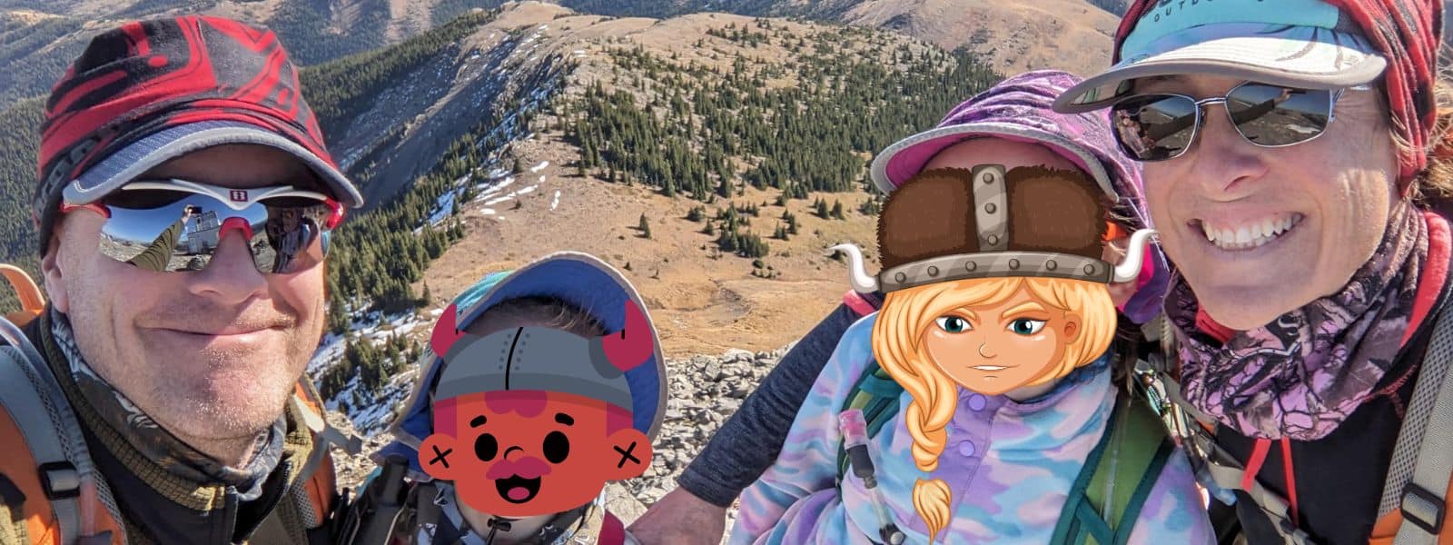 Coach JW and his family on a mountain ridge during a family training hike.